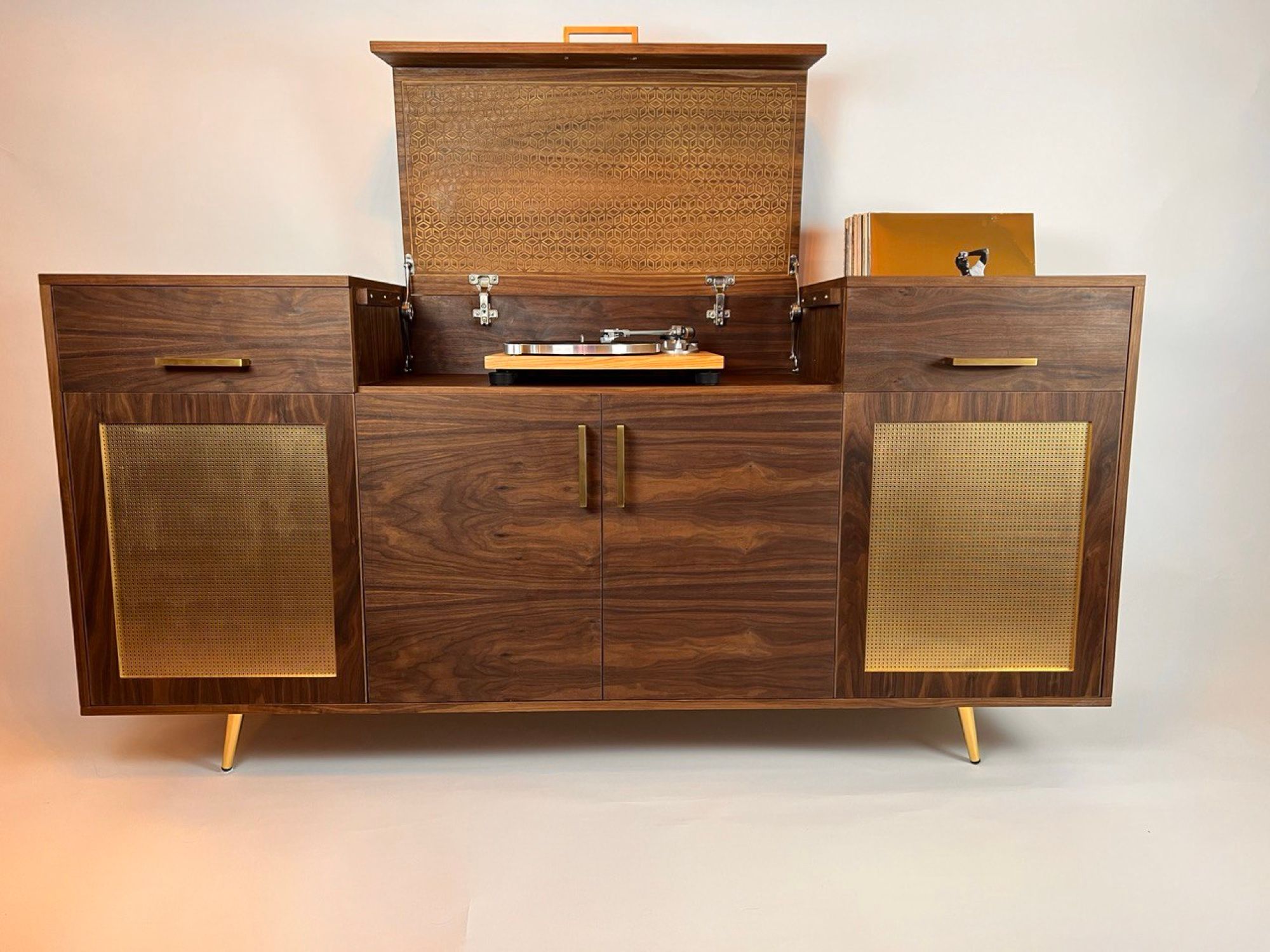 Custom walnut record console with brass mesh doors and tapered legs